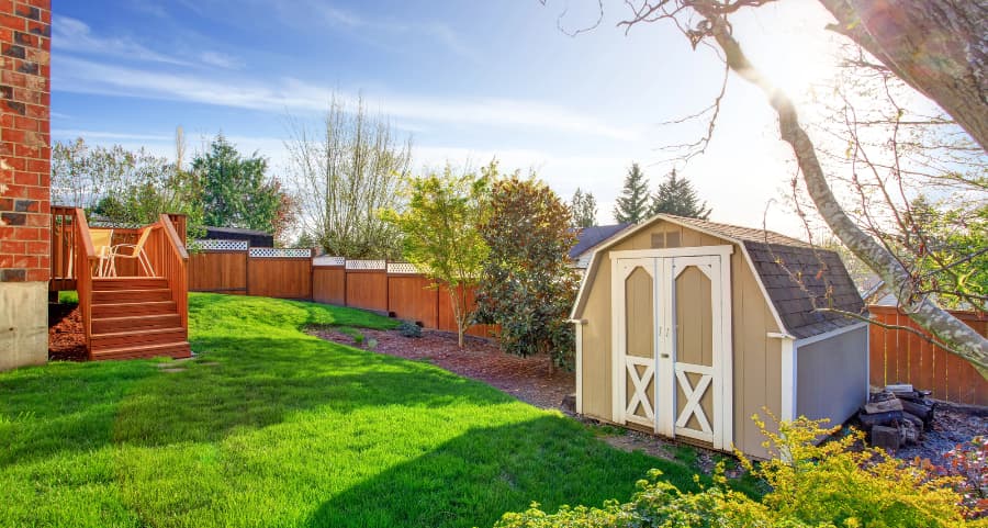 Fenced backyard with storage shed in Mansfield